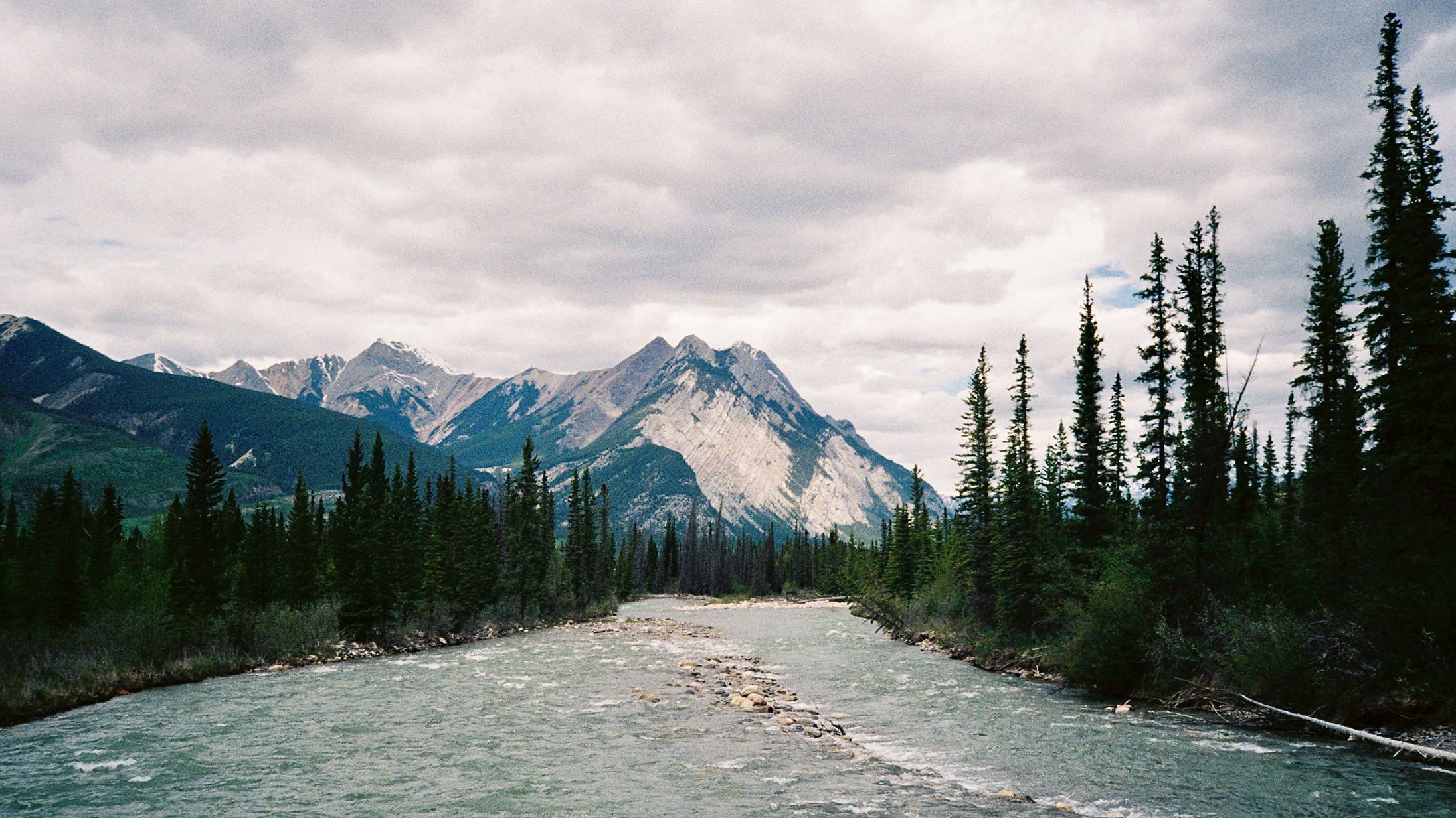 A river winding through a forested mountain valley