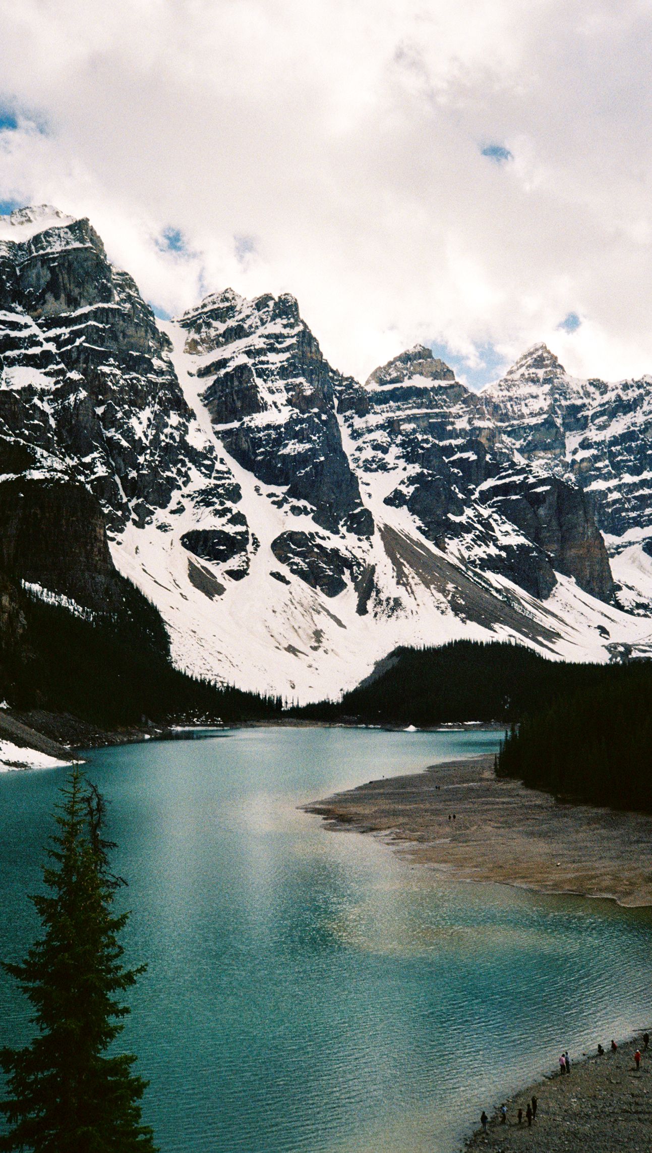 Moraine Lake in the Canadian Rockies, turquoise glacial water below snow-covered peaks